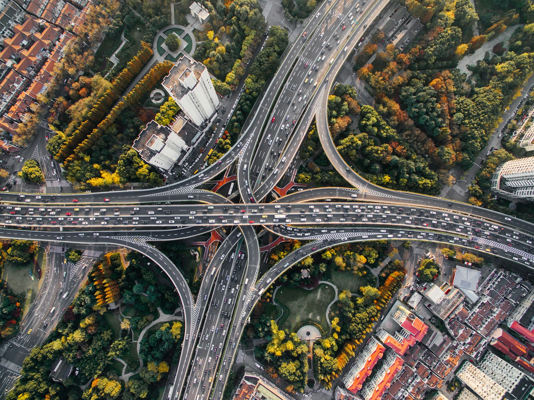 Aerial view of interconnected highways carrying traffic across an urban network